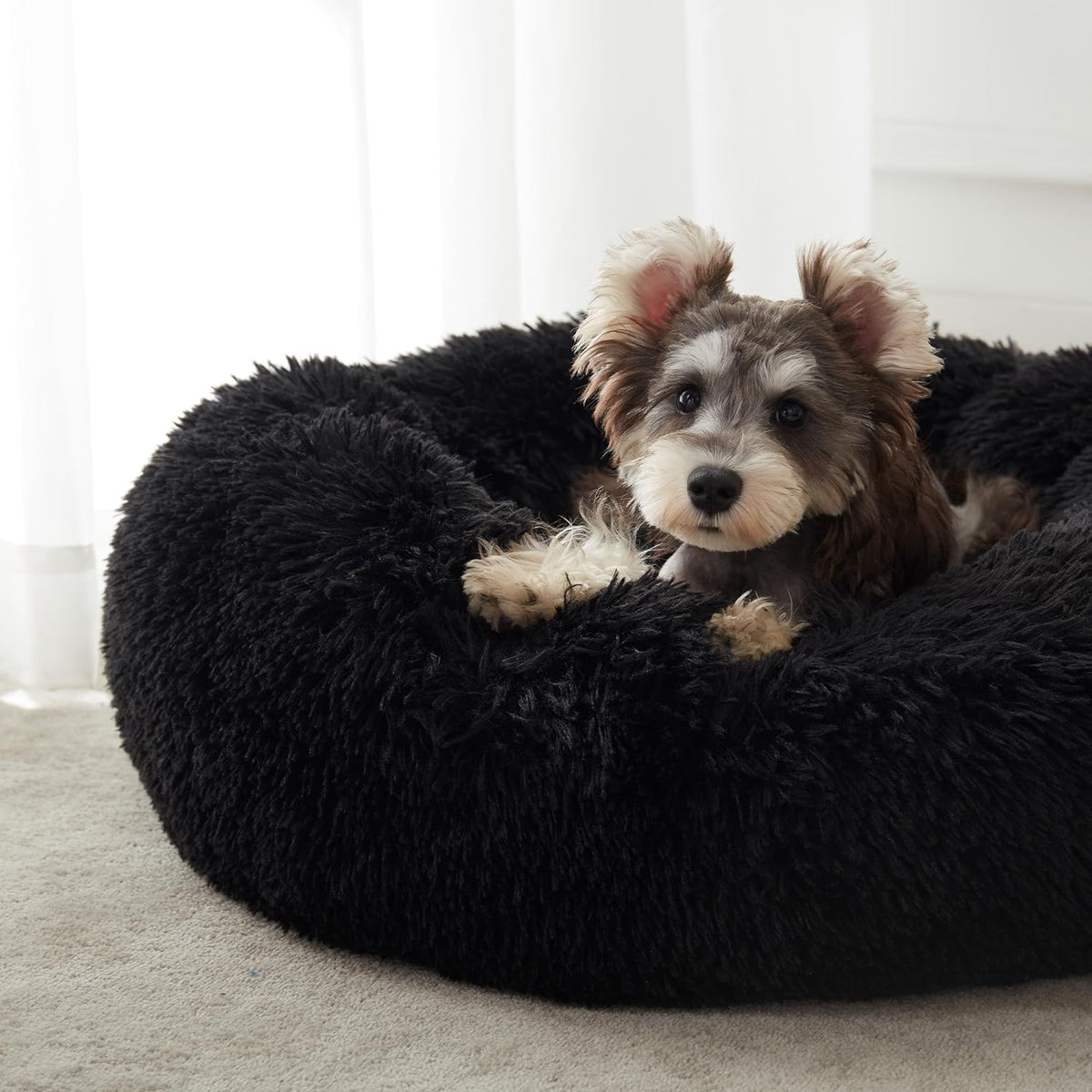 Black faux fur calming donut bed - close-up of faux fur
