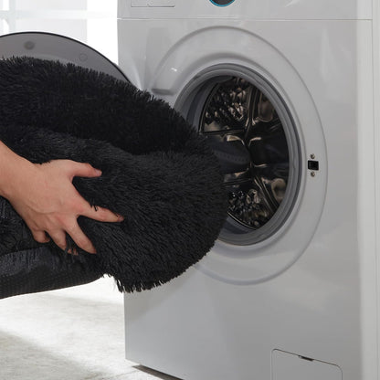 Black faux fur calming donut bed - machine washable